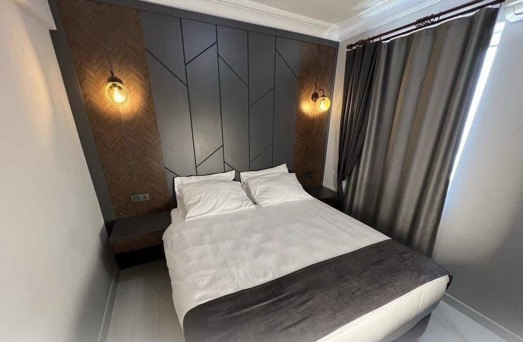 Modern hotel bedroom with designer headboard